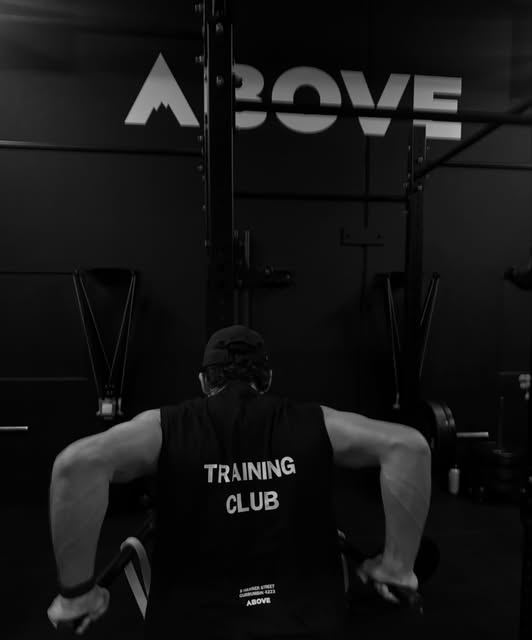 Member performing dips wearing a Training Club shirt
